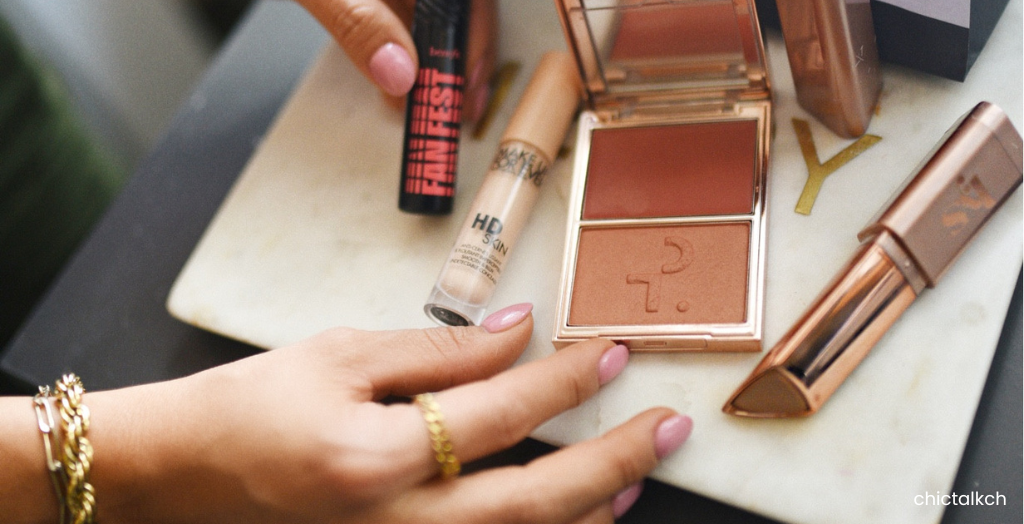 Close-up of beauty Creator, @chictalkch, showing off favorite makeup items, such as volumizing mascara and lipstick.
