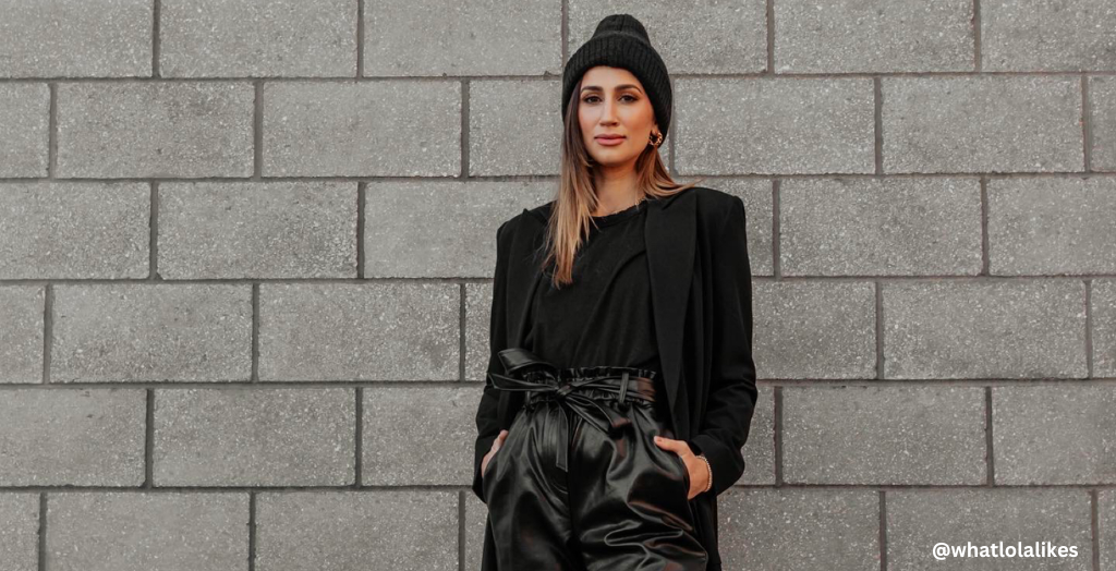 Fashion Creator whatlolalikes wearing an all-black ensemble in front of a gray brick wall