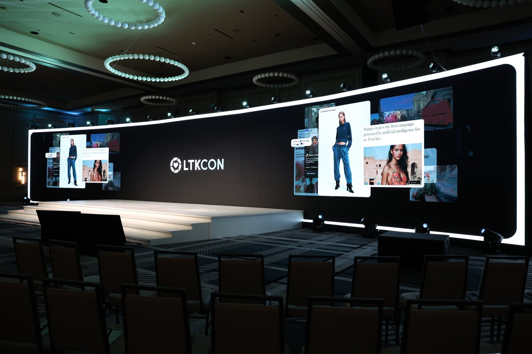 Stage of LTKCon event with a screen panel with graphics of creators.