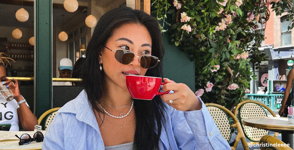 Influencer @christineleeee lounging and enjoying a cup of tea from a local small business